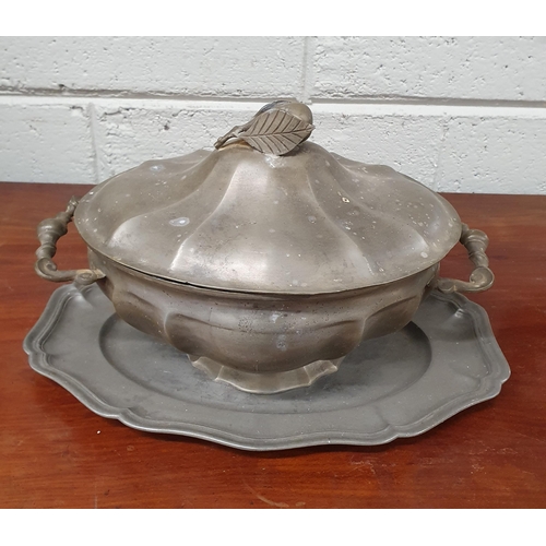 285 - A 19th Century Pewter centre Dish and Tray. 
33 x 22 x 22 cm approx.