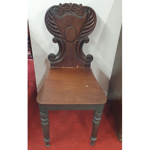 392 - A pair of early 19th Century Hall Chairs with fluted carved backs on turned supports. W 40 x SH 46 x... 