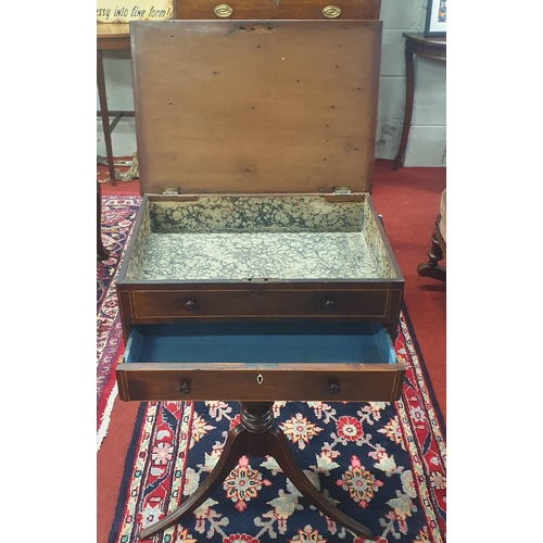 407 - An early 19th Century Mahogany Side Table with lift up lid and false front and sides on tripod base.... 