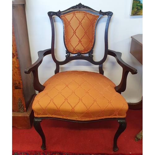 433 - A pair of late 19th Century Mahogany Armchairs with carved cabriole front supports and brass castors... 