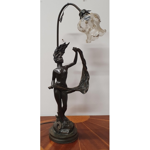 560 - A good Art Nouveau style table Lamp and shade with a free flowing look. H 69 cm approx.