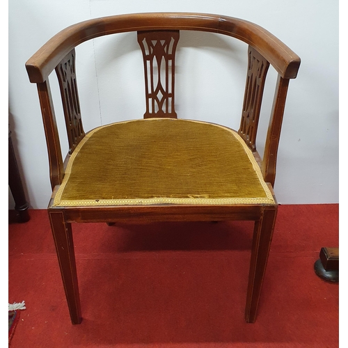 599 - An  Edwardian Mahogany Tub chair with pierced outline on square tapered supports.
W 56 x SH 43 x BH ... 