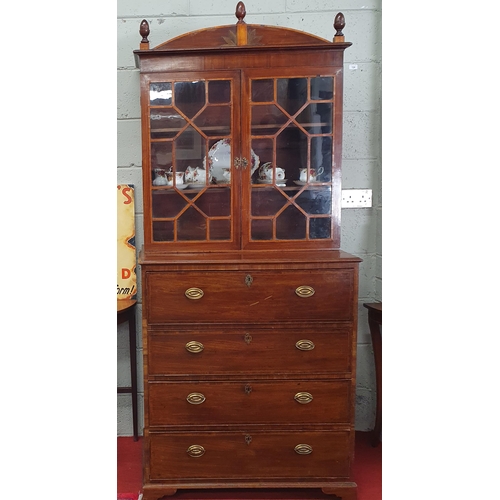 123 - An early 19th Century Regency Mahogany Seretaire Bookcase of neat proportions with brass ring handle... 