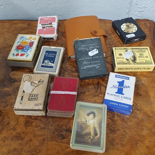 370 - A quantity of vintage Playing Cards along with binoculars.