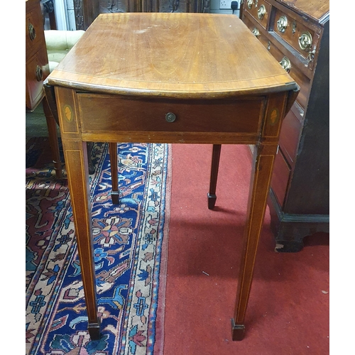 84 - An early Regency Mahogany Oval drop leaf Table with Satinwood cross banding on tapered inlaid suppor... 