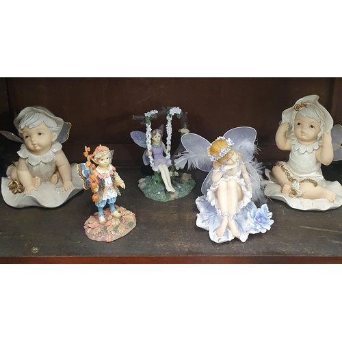 88 - A quantity of Porcelain and other figures on three shelves.