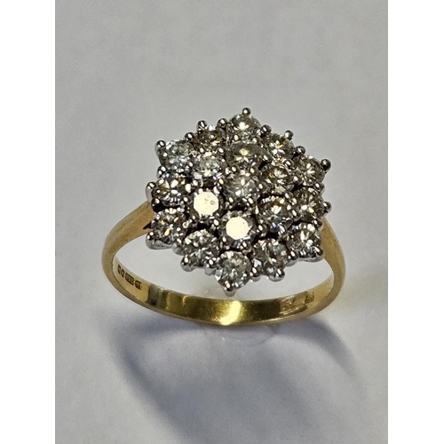 353 - An 18ct Gold and Diamond cluster Ring with brilliant cut Diamonds, size M, good colour and clarity.