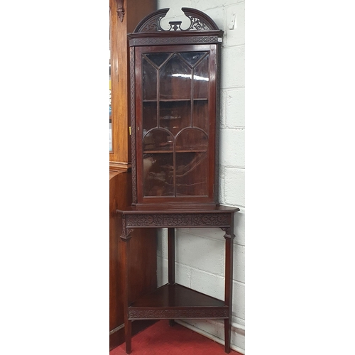 651 - An Edwardian Mahogany and Inlaid Corner Cabinet  with fretwork detail and architectural pediment top... 