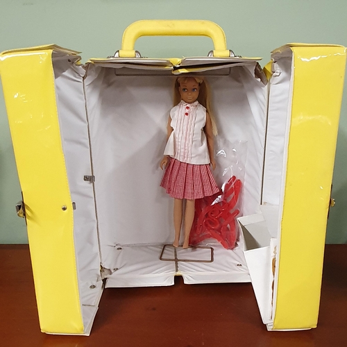 645 - A 1963 Skipper Scooter boxed Doll with extra outfits.