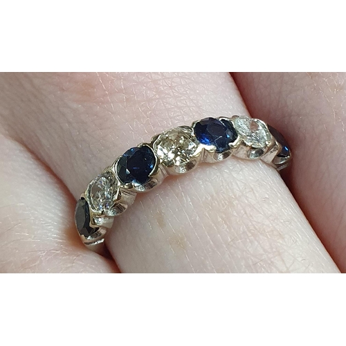 354 - An 18ct White Gold Diamond and Sapphire seven stone Ring, approx .9ct Diamond weight, size P1/2.