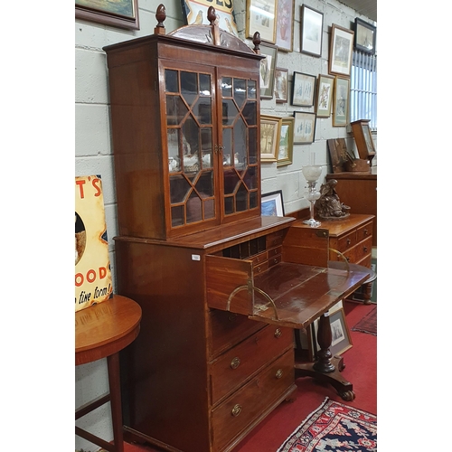 123 - An early 19th Century Regency Mahogany Seretaire Bookcase of neat proportions with brass ring handle... 