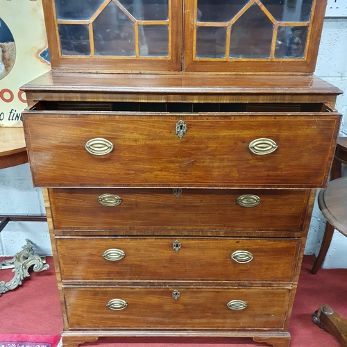 123 - An early 19th Century Regency Mahogany Seretaire Bookcase of neat proportions with brass ring handle... 