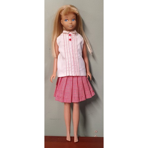 645 - A 1963 Skipper Scooter boxed Doll with extra outfits.