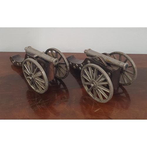 56 - A good pair of early 20th Century metal and timber mounted Cannons. 24 cm long.