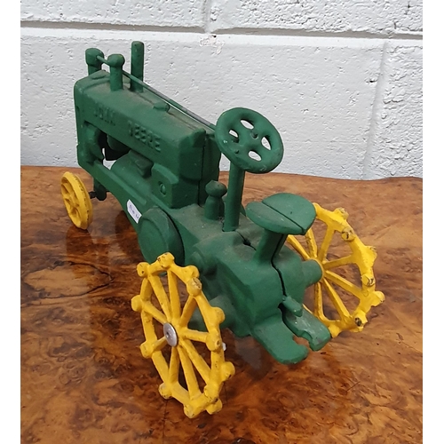 112 - A cast Iron John Deere Tractor. 30 x 18 cm approx.