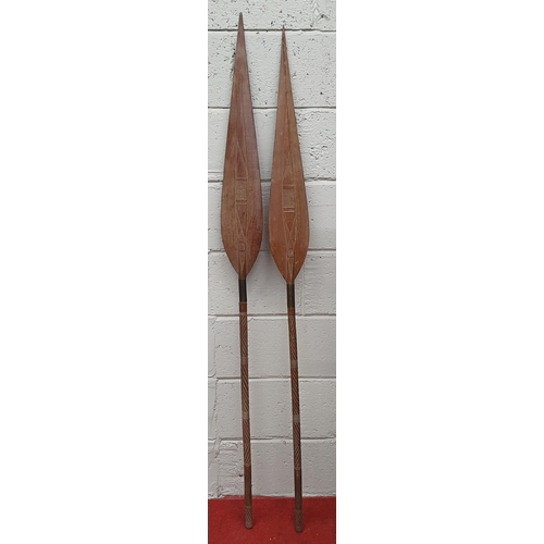 225 - A pair of early Fijian War Paddles with highly carved handles. L 165 cm approx.