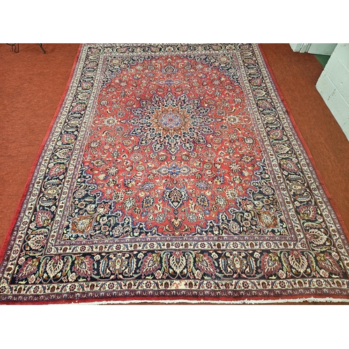 381 - A large Red ground fine handwoven Persian Mashed Carpet with a lozenge medallion design. 390 x 300 c... 