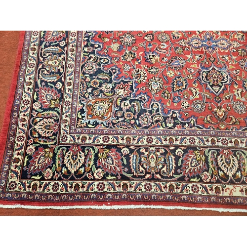 381 - A large Red ground fine handwoven Persian Mashed Carpet with a lozenge medallion design. 390 x 300 c... 