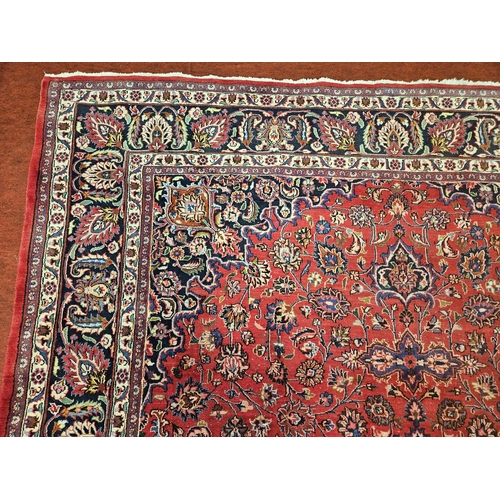 381 - A large Red ground fine handwoven Persian Mashed Carpet with a lozenge medallion design. 390 x 300 c... 