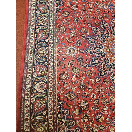 381 - A large Red ground fine handwoven Persian Mashed Carpet with a lozenge medallion design. 390 x 300 c... 