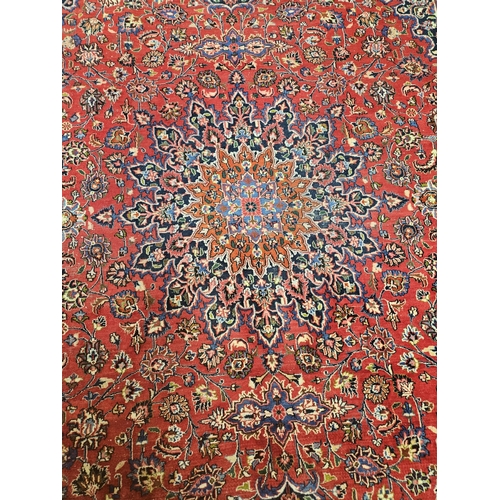 381 - A large Red ground fine handwoven Persian Mashed Carpet with a lozenge medallion design. 390 x 300 c... 