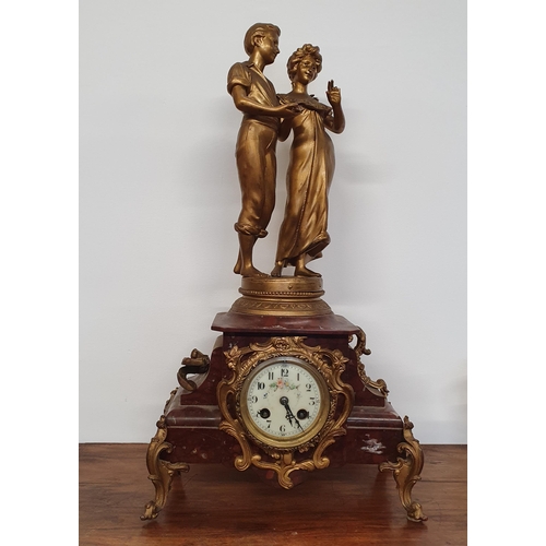 439 - A Superb 19th Century Clock depicting a loving couple. H 52 cm approx.