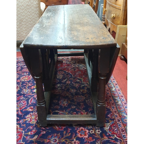 521 - An 18th Century possibly earlier Oak Gateleg Table of large size.
W 138 x 164 x H 69 cm approx.