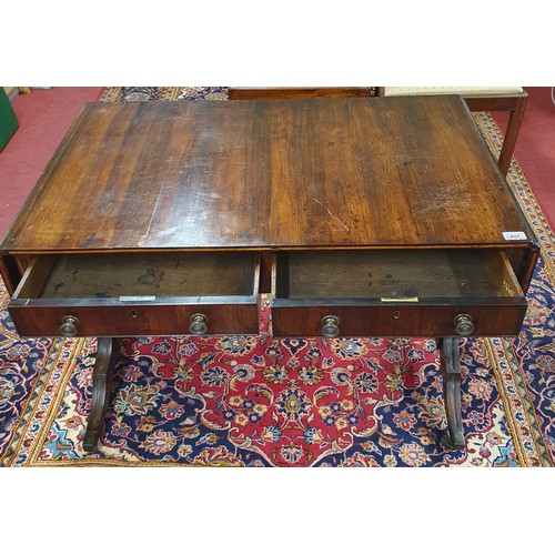 657 - A Superb 19th Century Rosewood Sofa Table of neat proportions with twin frieze drawers on splayed su... 