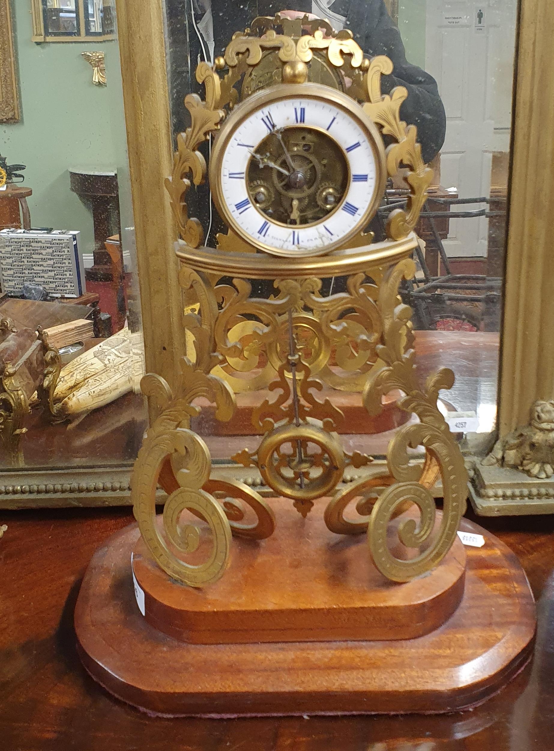 A good 19th Century French Skeleton Clock with enamel dial on a timber ...