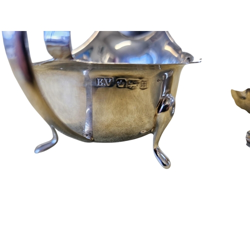 307 - A London Silver milk Jug along with a Sheffield Silver sauce Boat, 265 grams approx. TB 7 cm approx.