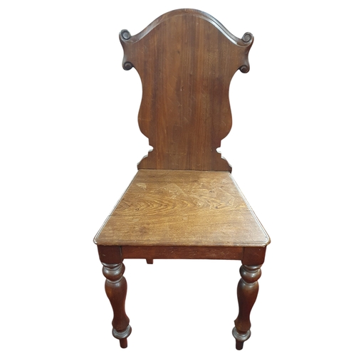 130 - A 19th Century Mahogany shield back Hall Chair on turned front supports.
43 x SH 42 x BH 90 cm appro... 