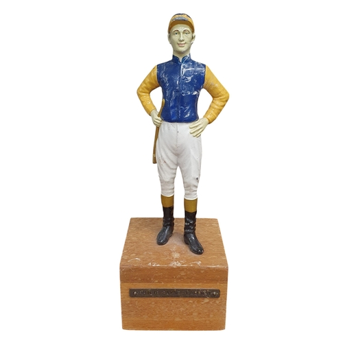 438 - A Metal figure of Jockey Philip Pane Galloway on Timber stand. 
H 31 cm approx.