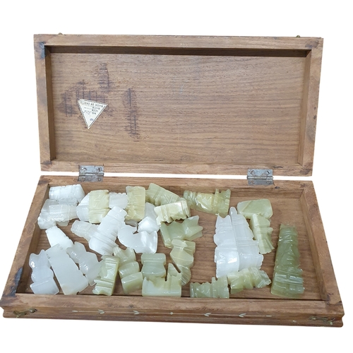 443 - A good Hardwood Chess Cabinet with stone chess pieces.