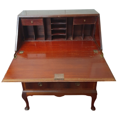 446 - An Edwardian Mahogany and inlaid Bureau of neat proportions on cabriolet front supports. W 76 x D 46... 
