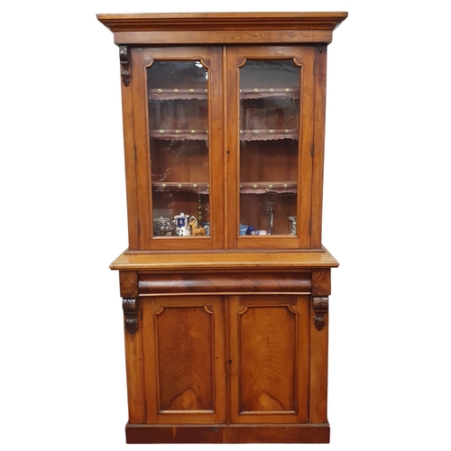 462 - A Victorian Mahogany two door Bookcase with single frieze drawer.111 x 46 x H 204 cm approx.