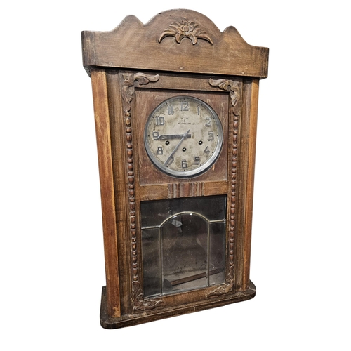 445B - An early 20th century Wall Clock with Silver and Chrome dial, Muthe Extra on the dial. 47 x 18 x 78 ... 