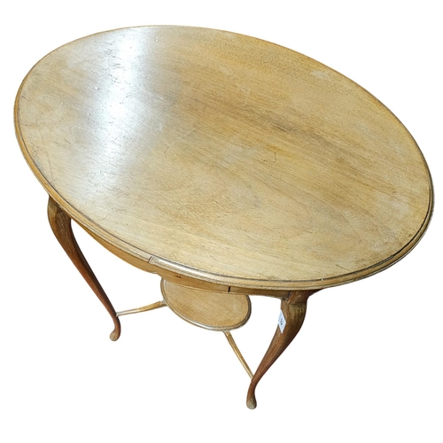 451 - A very neat Edwardian Blond Mahogany oval Lamp Table with single frieze drawer.
H 69 x D 55 cm appro... 