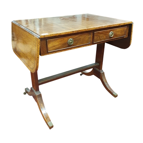 132 - A 19th Century Mahogany and Veneered Sofa Table of neat proportions with twin frieze drawers on spla... 