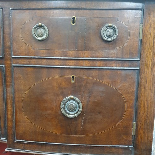 466 - A late 19th early 20th Century bow fronted Sideboard of neat proportions with square tapered support... 