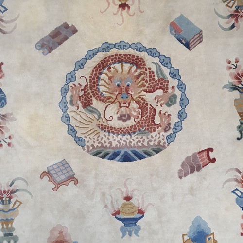 159 - A cream ground Oriental Carpet with Greek key border design. 244 x 345 cm approx.