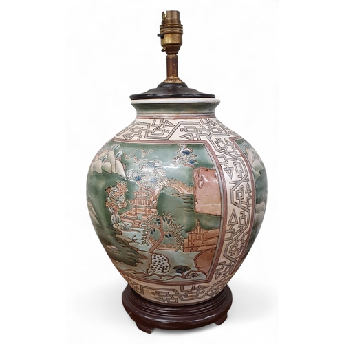 657 - A large Oriental bulbous Lamp with hand painted panel decoration. H 40 cm approx.