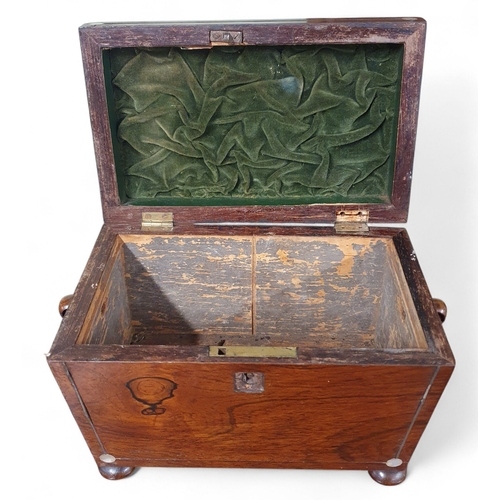 27 - A Regency Rosewood sarcophagus shaped Tea Caddy with mother of pearl inlay.
H 16 x 20 x 12 cm approx... 