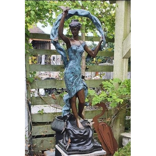 29 - A fantastic Bronze Figural Group of a woman holding a ribbon with birds landing. 107 x 35 cm approx.