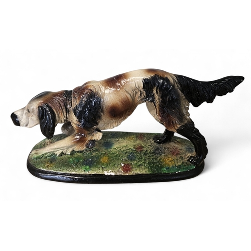 43 - A 20th Century Figure of a spaniel. L 32 cm approx.