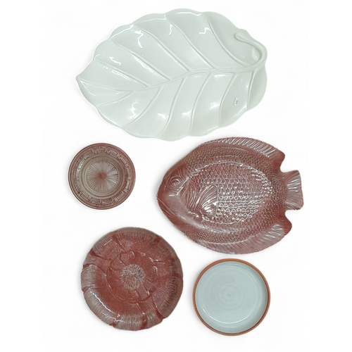 142 - A good quantity of Lustre Ware along with two 19th Century meat platters and other items on four she... 