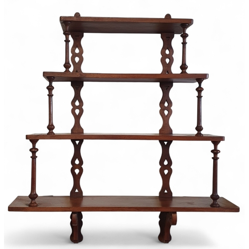 40 - A 19th Century Walnut four tier wall mounted Bracket with turned supports and pierced back.
W 71 x D... 