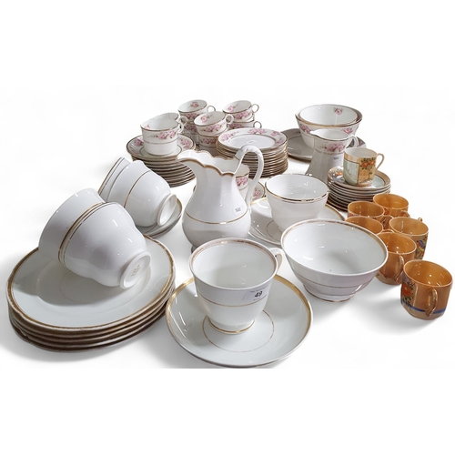 49 - A Crown Chinaware Teaset in the pink rose floral pattern along with a Duchess Ascot pattern teaset a... 