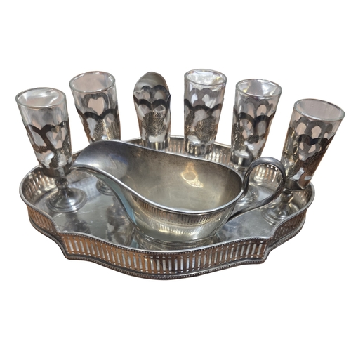 349 - A Silver Mappin & Webb sauce Boat, egg cup along with six liqueur glasses a set of Silver handled pi... 