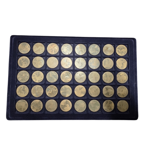 386 - An extremely large quantity of primarily British Pennies, some Irish. In a metal coin case.