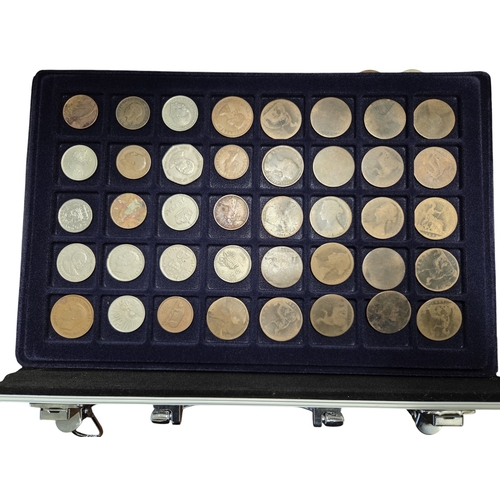 387 - An extremely large quantity of Irish Pennies and other coins. In a metal coin case.